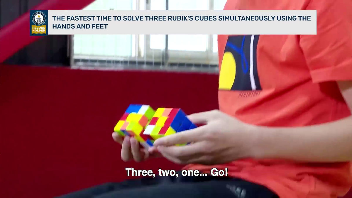 Guinness World Record Which Establishes Three Rubik S Cubes At One