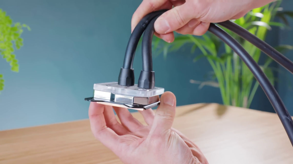 DIY PS5 Slim hides a water-cooling brick behind a TV cabinet, almost melts