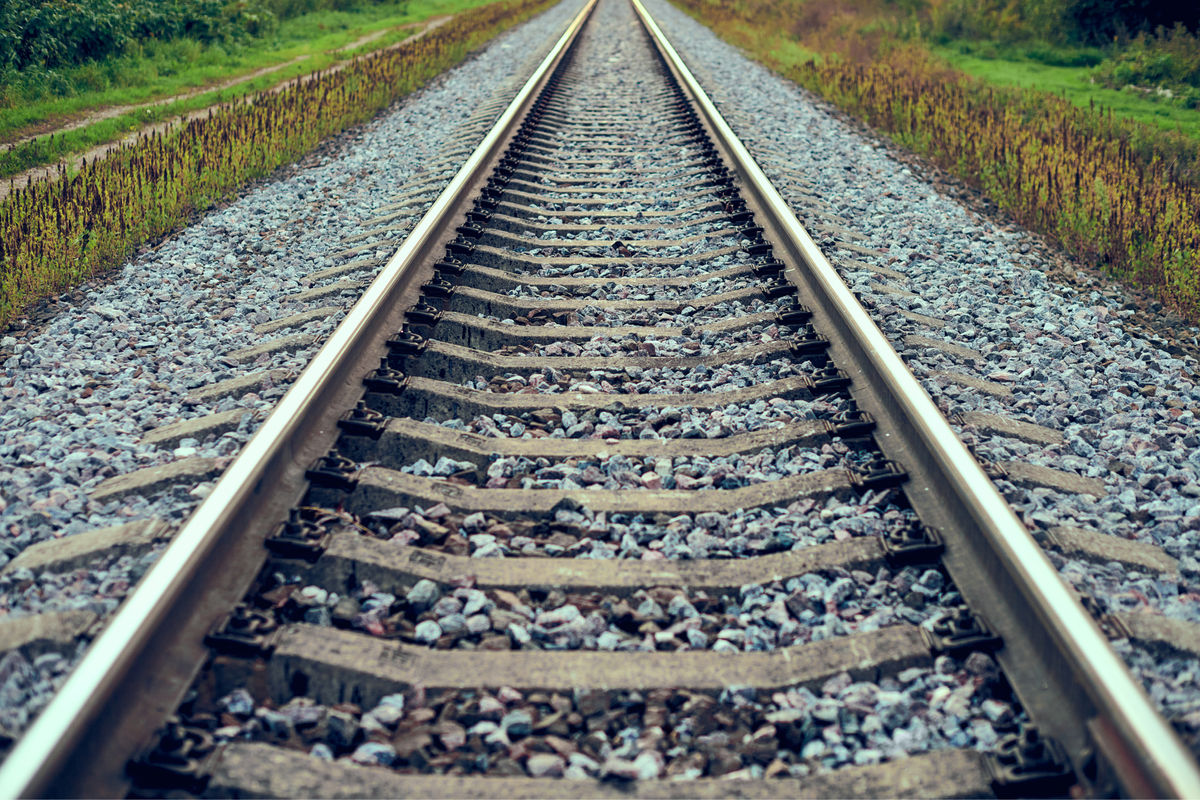 Why do railway tracks have crushed stones alongside them? - Alpha Rail