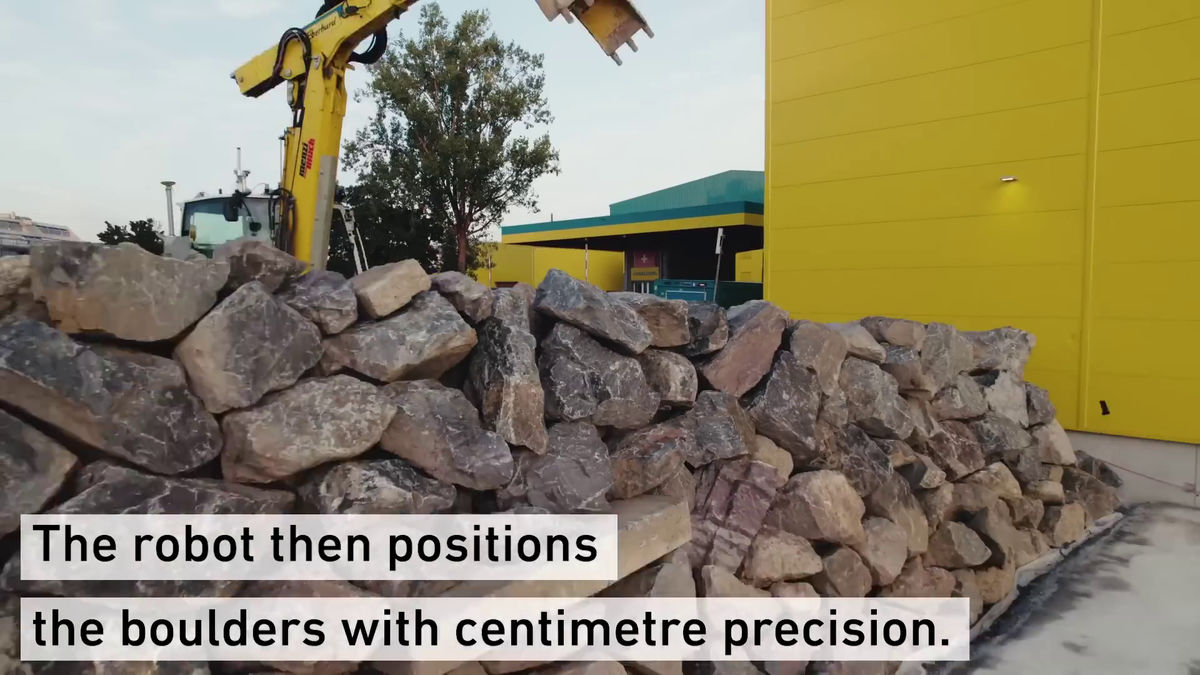 Construction robot builds massive stone walls on its own